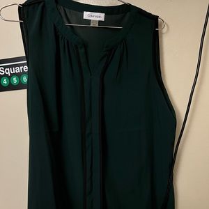 Sleeveless green shirt for work
